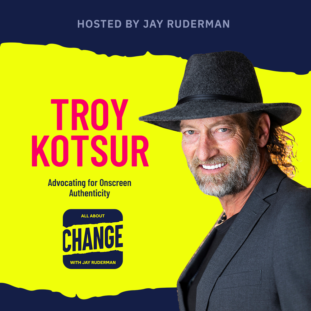 Square graphic with blue and yellow background. The blue is on the top and bottom and the yellow is sandwiched in between. On the lower right side is a photo of Troy Kotsuro. He is posing. On the top in red bold letters reads “Troy Kotsur” below is an All About Change logo. It's blue on top and bottom with yellow sandwiched in the middle. Top blue with yellow text reads "All About", Middle Yellow with blue text reads "Change", and bottom blue with yellow text reads "With Jay Ruderman."